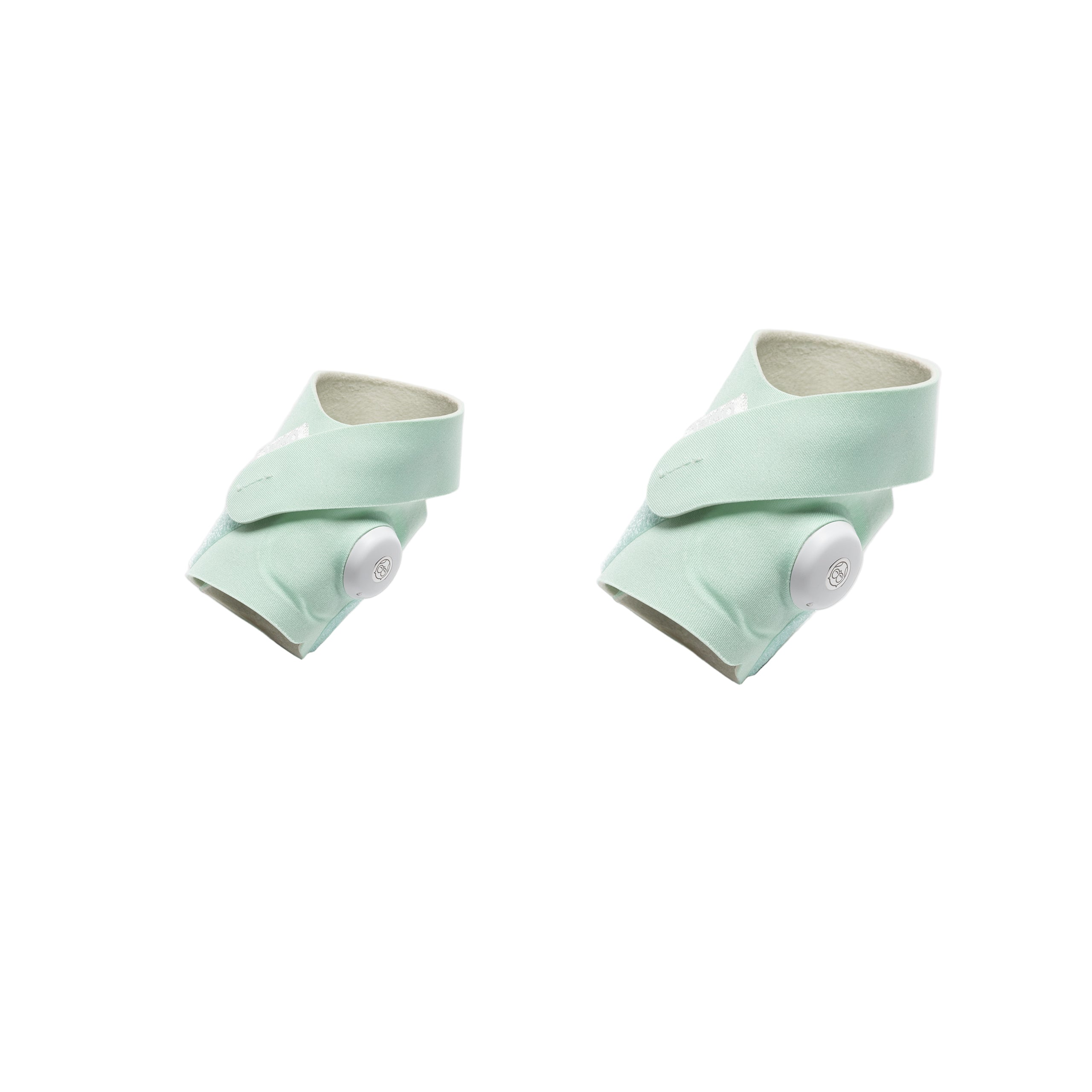Das Owlet Dream Sock Set Mint (Gr. 1 + Gr. 2) von Owlet besteht aus weichen, orthopädischen Knöchelhosen mit verstellbaren Riemen und weißen, kreisförmigen Ziffernblättern, die auf weißem Hintergrund abgebildet sind.