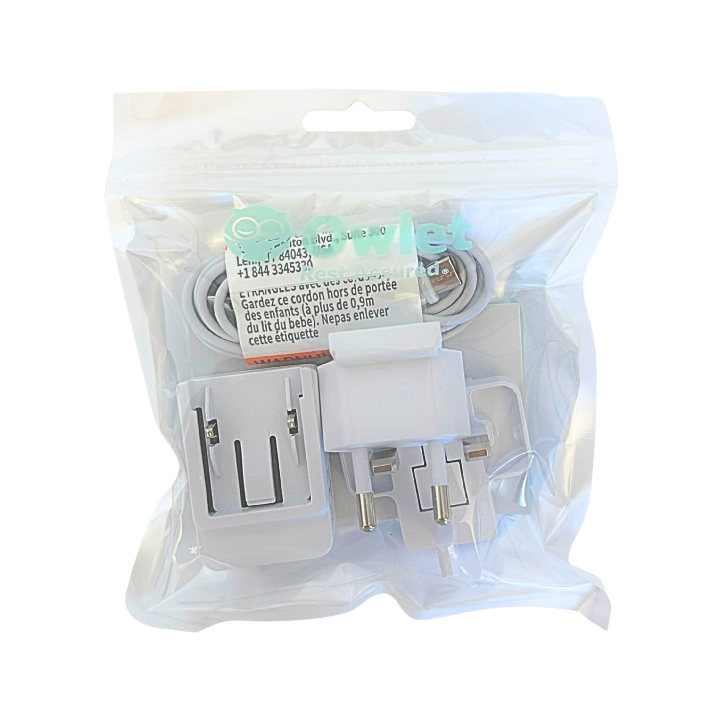 Das Owlet Dream Sock Kabel von Owlet wird in einem durchsichtigen, wiederverschließbaren Plastikbeutel geliefert. Das Etikett enthält Sicherheitshinweise und Produktinformationen in französischer Sprache.