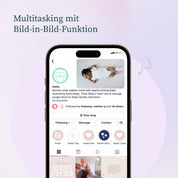 Ein Smartphone zeigt das Instagram-Profil von Owletcare.de, auf dem das Owlet Dream Bundle vorgestellt wird: Dream Sock + Cam 2. Darüber steht "Multitasking mit Bild-in-Bild-Funktion" auf Deutsch vor einem sanften lila Hintergrund.